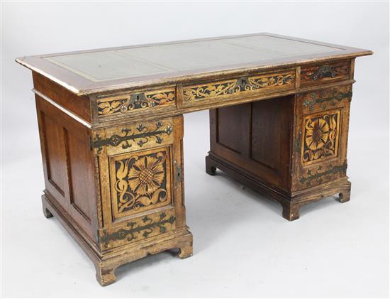 A late Victorian carved oak pedestal desk, W. 4ft 7in. D. 2ft 8in. H. 2ft 6in.